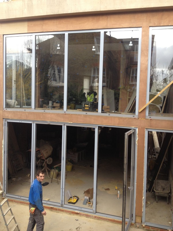 Aluminium bi-fold doors with two-storey glazing in Palmers Green