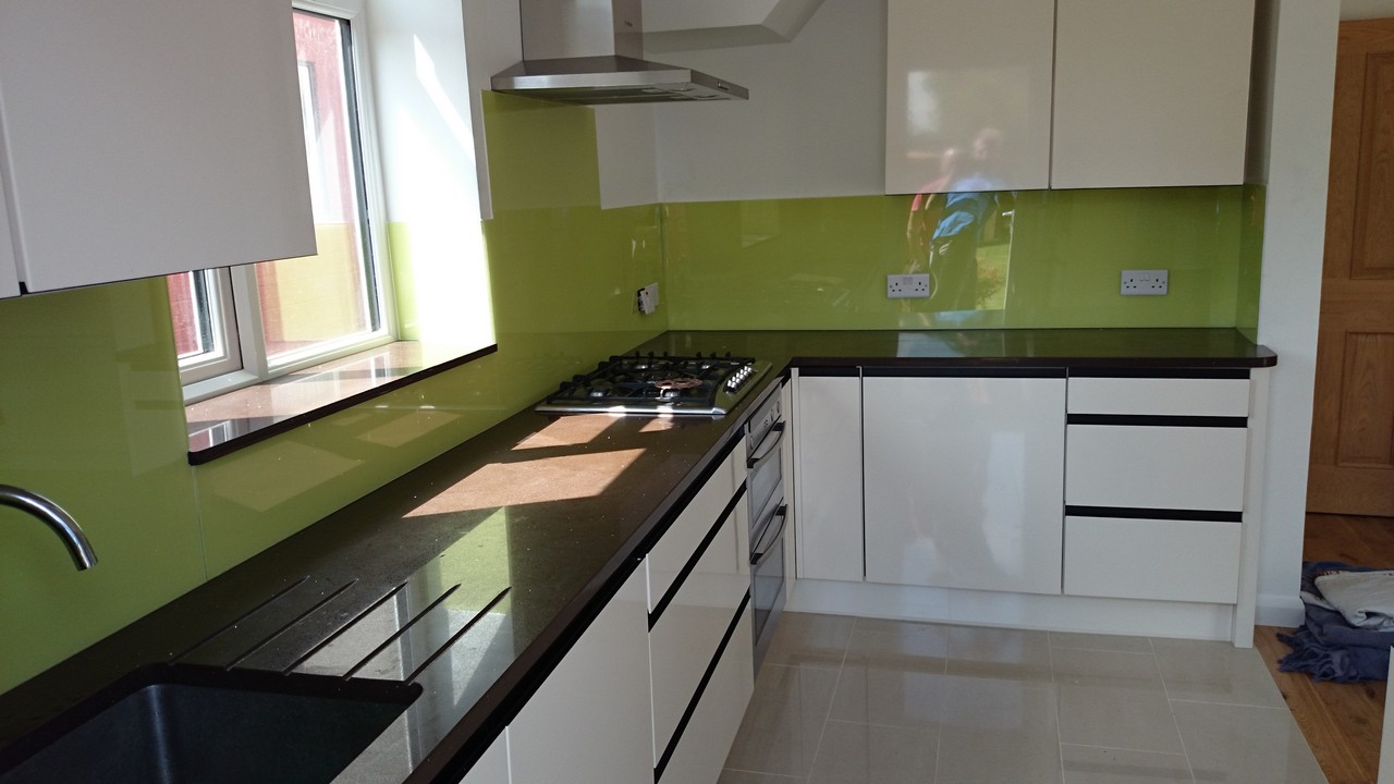 Lime green glass kitchen splashback installed by Palmers Green glaziers