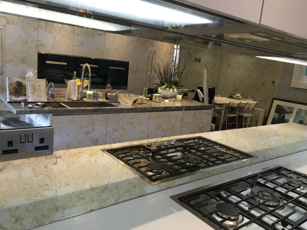 Mirror glass splashback in Palmers Green luxury kitchen