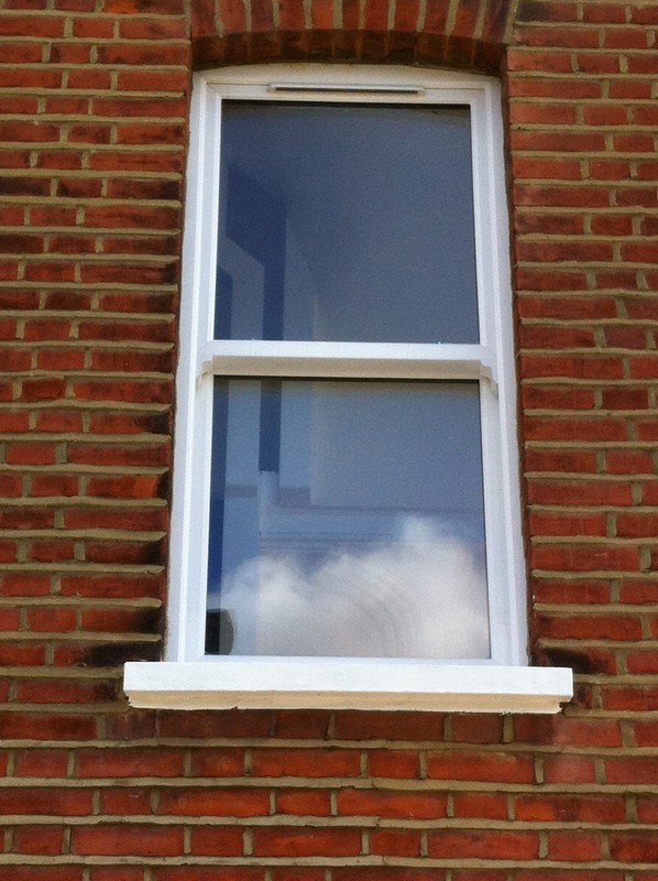 uPVC sash window on Victorian red brick house in Palmers Green